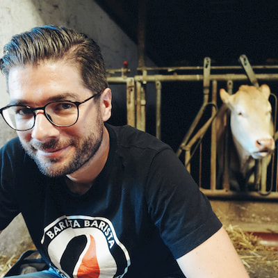 Photo of Bascht with a cow in the background